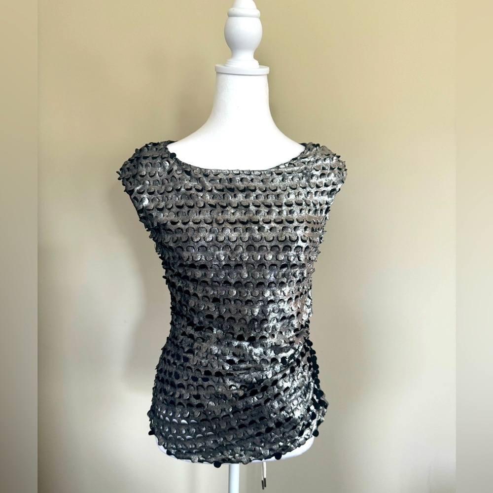 Cartise laser cut top in silver. Used once, like new! Size 4US